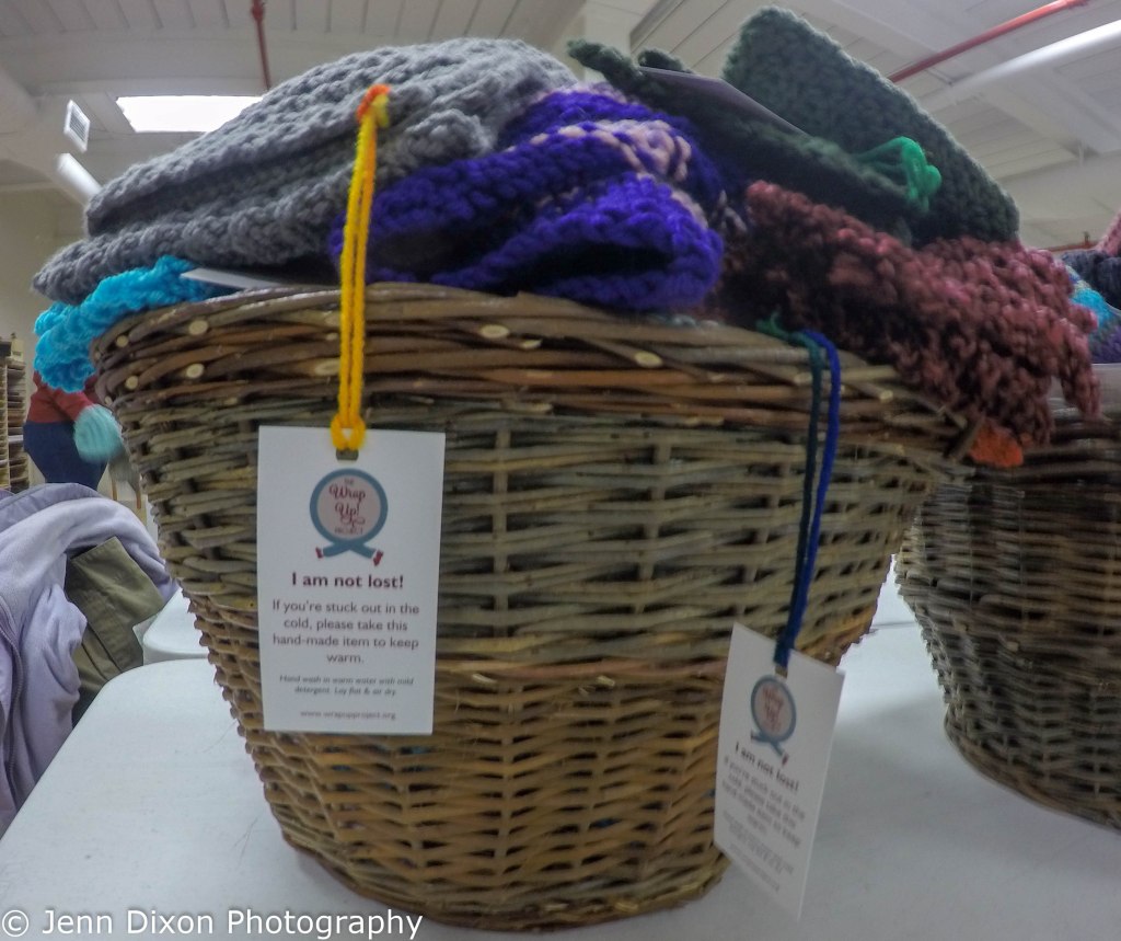 a basket of scarves